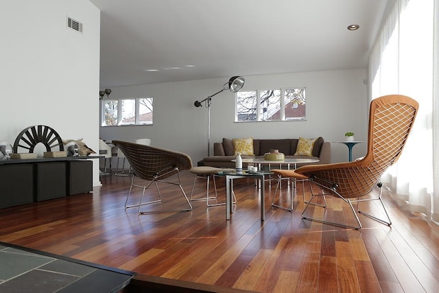 sitting room with dark wood-type flooring