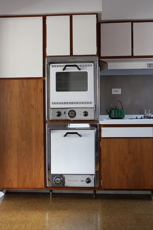 101 Point Breeze Pl, Point Breeze, PA 15208 - kitchen featuring light countertops, double oven, and brown cabinetry