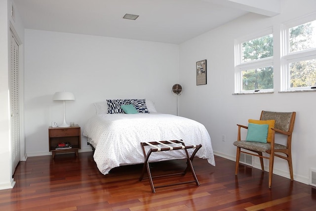 bedroom featuring dark hardwood / wood-style floors