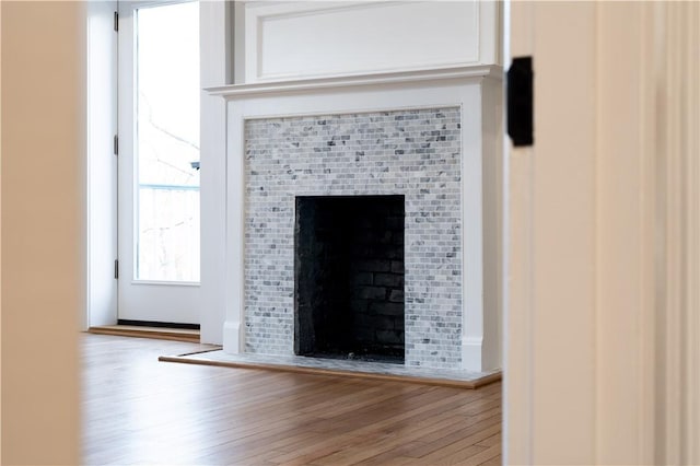 room details featuring hardwood / wood-style flooring and a fireplace