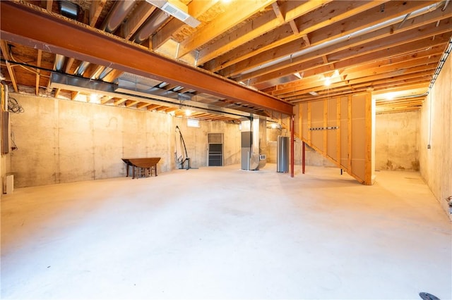 basement with heating unit and water heater