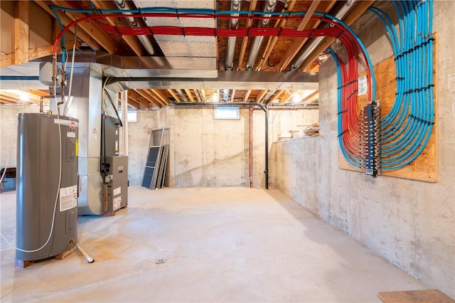 basement featuring heating unit and water heater