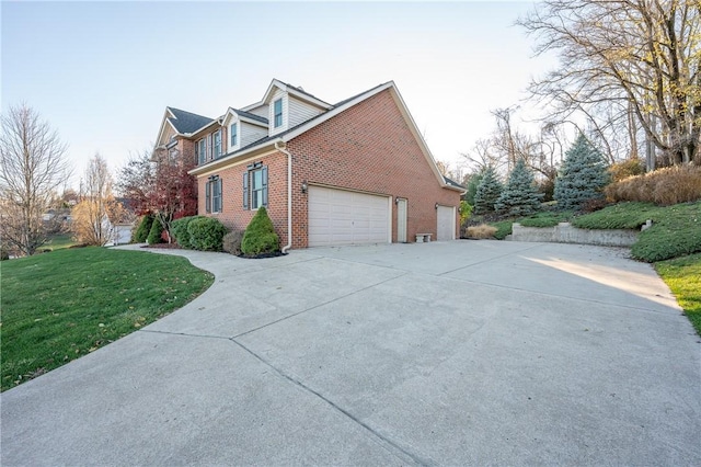 view of home's exterior with a lawn and a garage