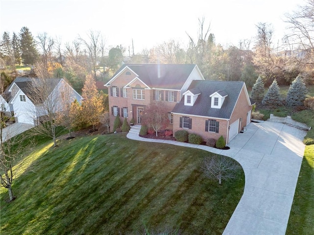 view of front of property featuring a garage and a front yard