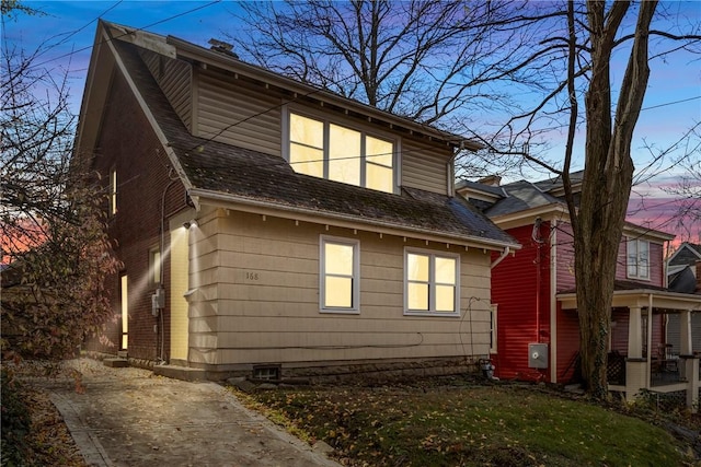 view of property exterior at dusk