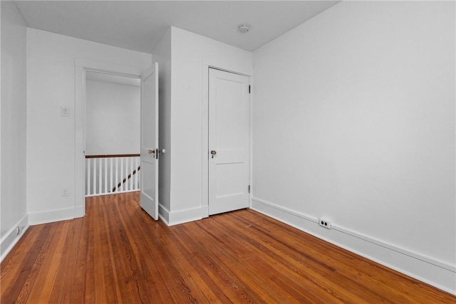 spare room with wood-type flooring