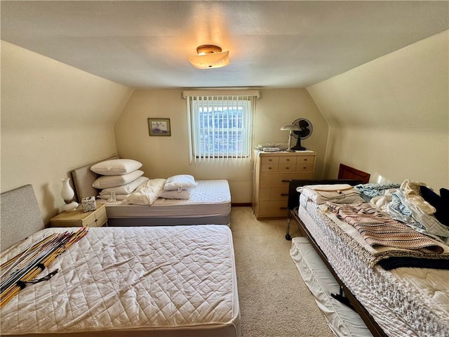 carpeted bedroom with vaulted ceiling