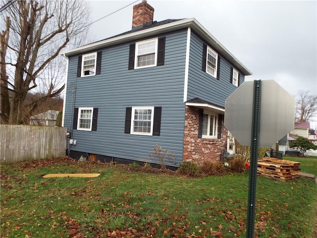 view of property exterior featuring a lawn