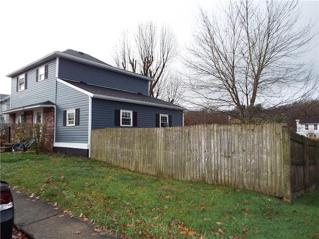 view of property exterior featuring a yard