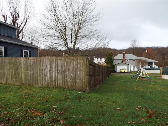 view of yard featuring a garage