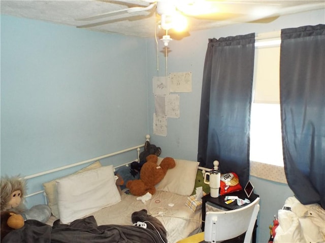 bedroom featuring ceiling fan