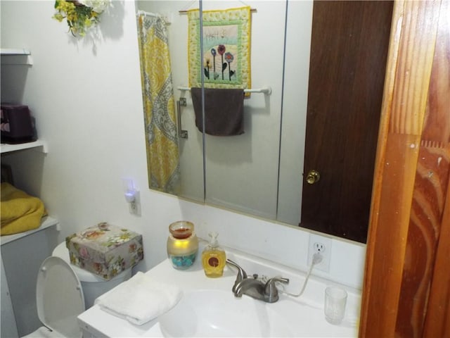 bathroom with toilet and sink