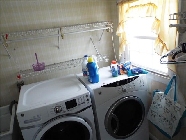 laundry area with washing machine and clothes dryer