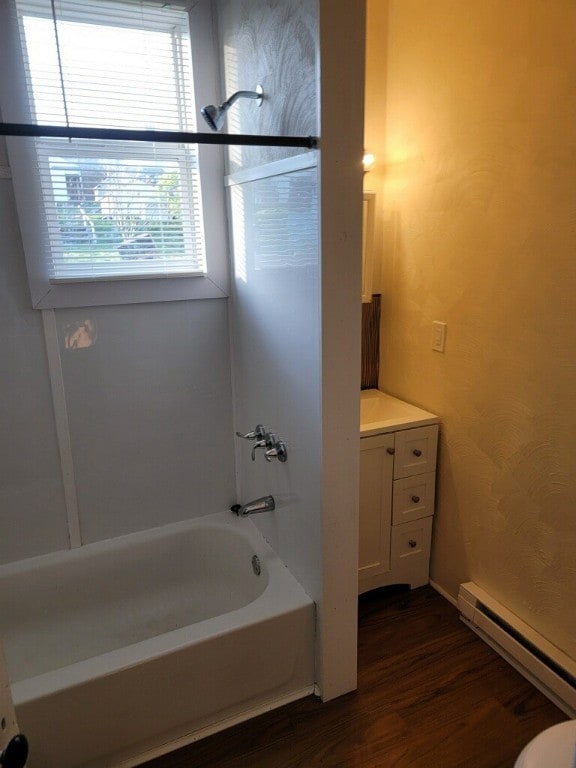 409 1st St, East Bethlehem, PA 15368 - full bathroom featuring baseboard heating, wood finished floors, bathtub / shower combination, and vanity