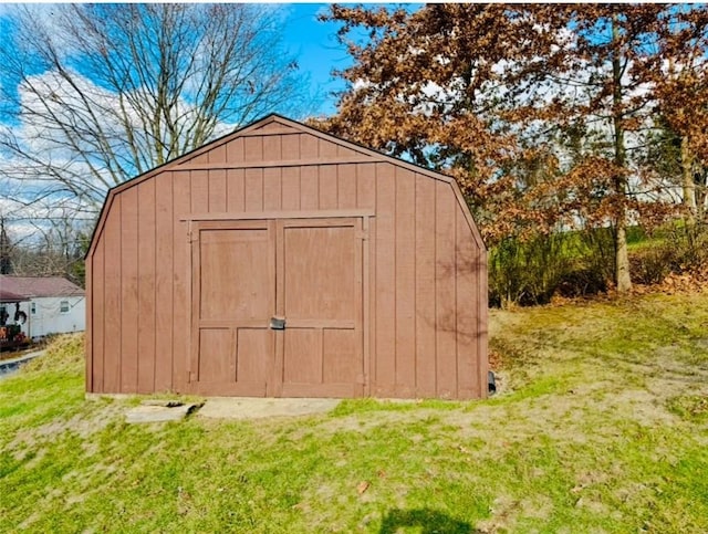 view of outbuilding with a lawn