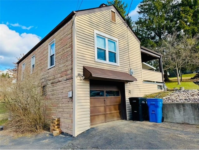 view of side of home with a garage