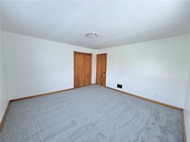 empty room with light colored carpet