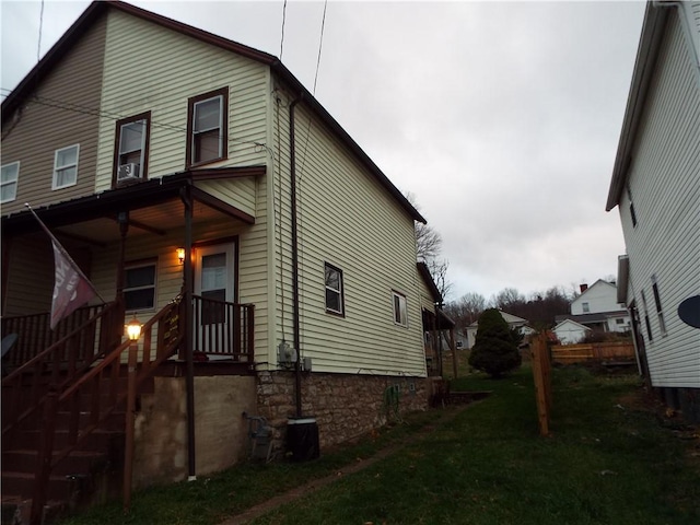 view of home's exterior featuring a yard