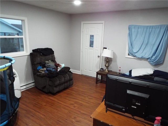 sitting room featuring dark hardwood / wood-style flooring and a baseboard radiator