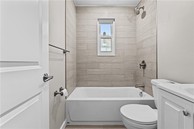 full bathroom with vanity, toilet, and tiled shower / bath