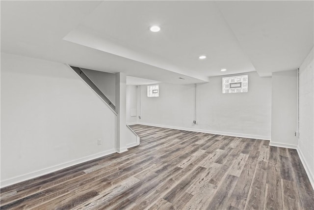 basement with hardwood / wood-style flooring