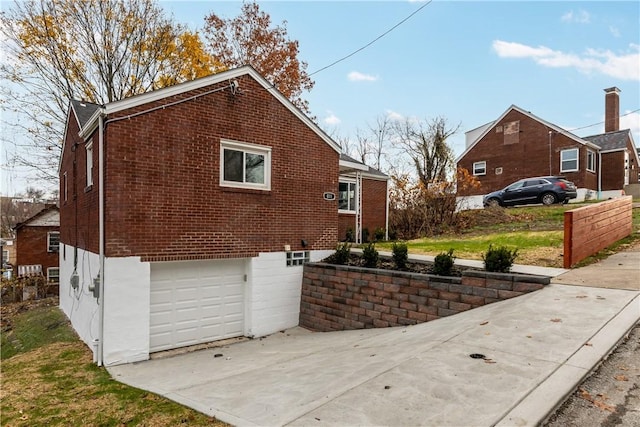 view of side of home featuring a garage