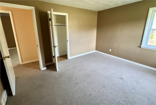 unfurnished bedroom with carpet