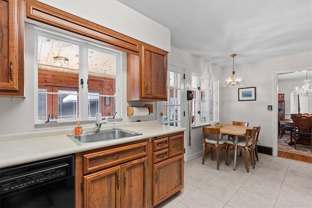 kitchen featuring sink, dishwasher, hanging light fixtures, an inviting chandelier, and light tile patterned flooring