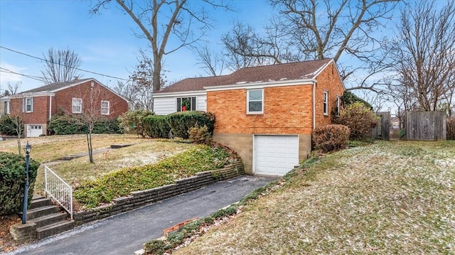 view of side of home featuring a garage