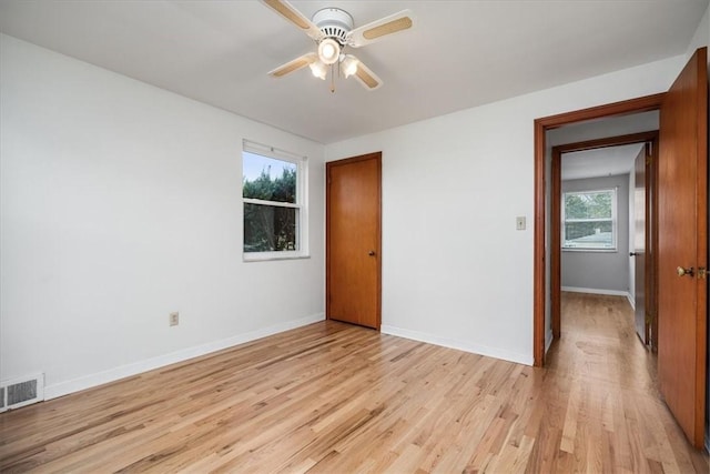 spare room with ceiling fan and light hardwood / wood-style floors