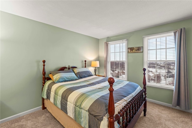 bedroom with light colored carpet