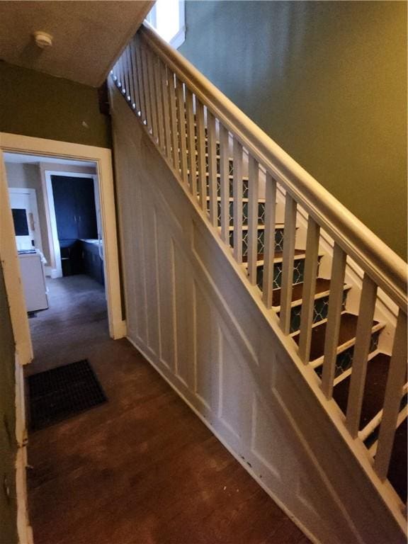 stairway featuring hardwood / wood-style flooring