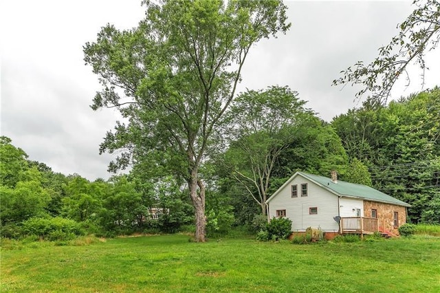 view of yard featuring a wooden deck