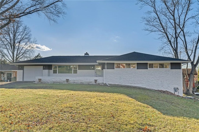 ranch-style home with a garage and a front yard