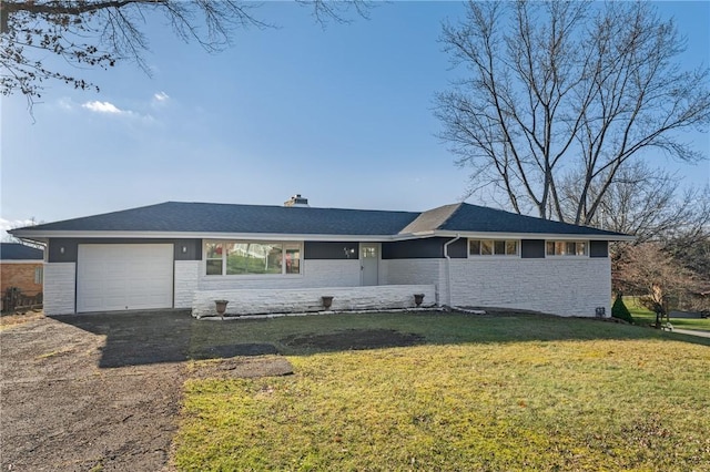 ranch-style home featuring a garage and a front lawn