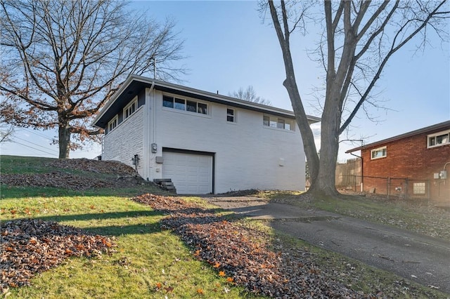 back of property featuring a garage