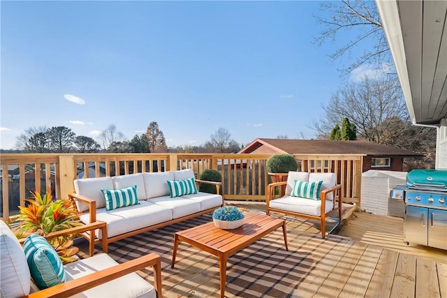 wooden terrace with an outdoor living space