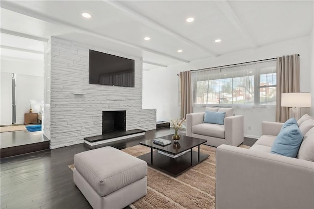 living room with a fireplace, hardwood / wood-style floors, and beam ceiling