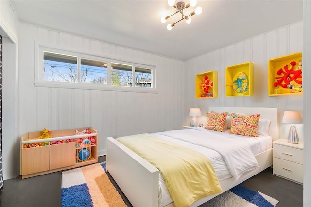 bedroom featuring an inviting chandelier