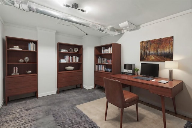 office featuring dark colored carpet and crown molding