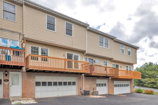 back of property featuring central AC unit