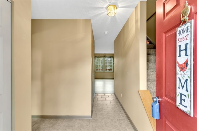 hallway with light tile patterned floors