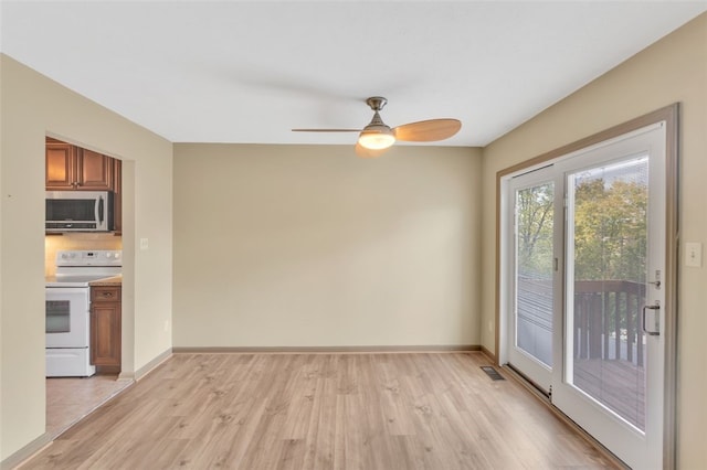 interior space featuring ceiling fan and light hardwood / wood-style floors