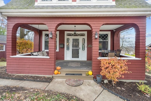 property entrance featuring covered porch