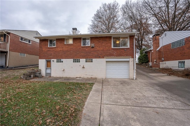 back of house featuring a garage