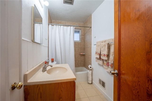 bathroom featuring shower / bath combination with curtain, vanity, and tile patterned floors