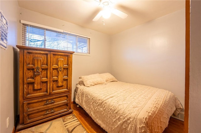 bedroom featuring ceiling fan and wood-type flooring