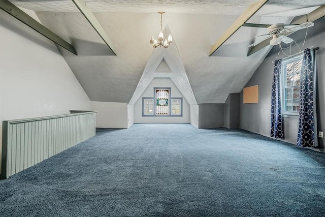 bonus room with a textured ceiling, ceiling fan with notable chandelier, a wealth of natural light, and lofted ceiling