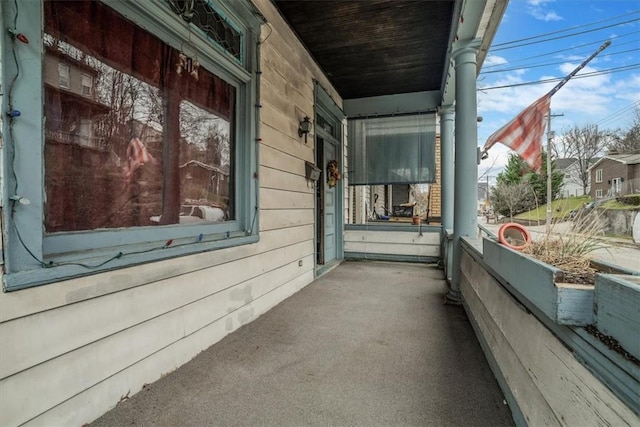 view of side of home featuring a porch