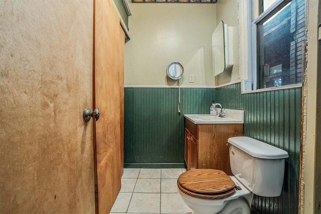 bathroom featuring toilet, vanity, and tile patterned floors